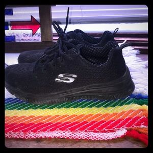 Skechers black on black sneakers.